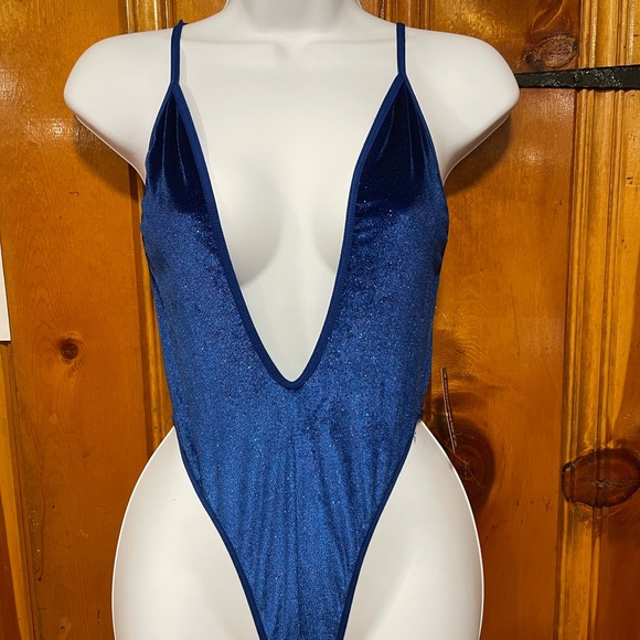 Tops - Never worn plunging blue bodysuit